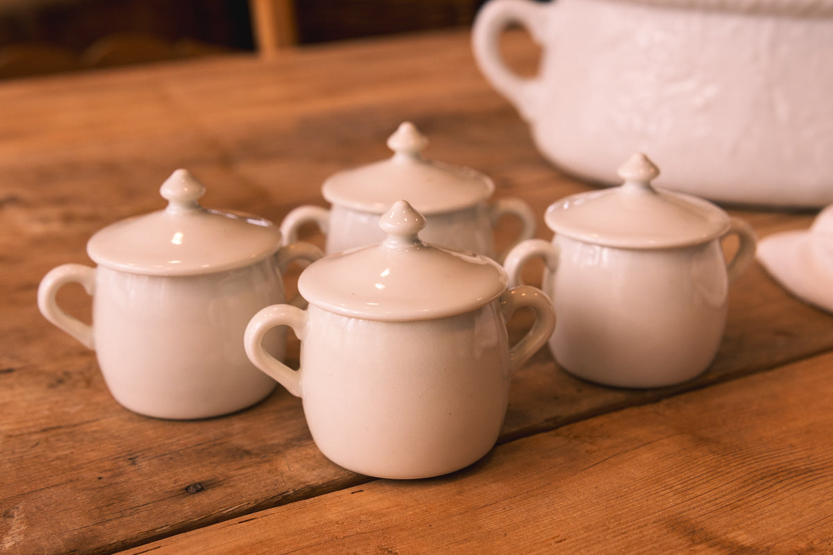 Set of Four French Porcelain Covered Pots